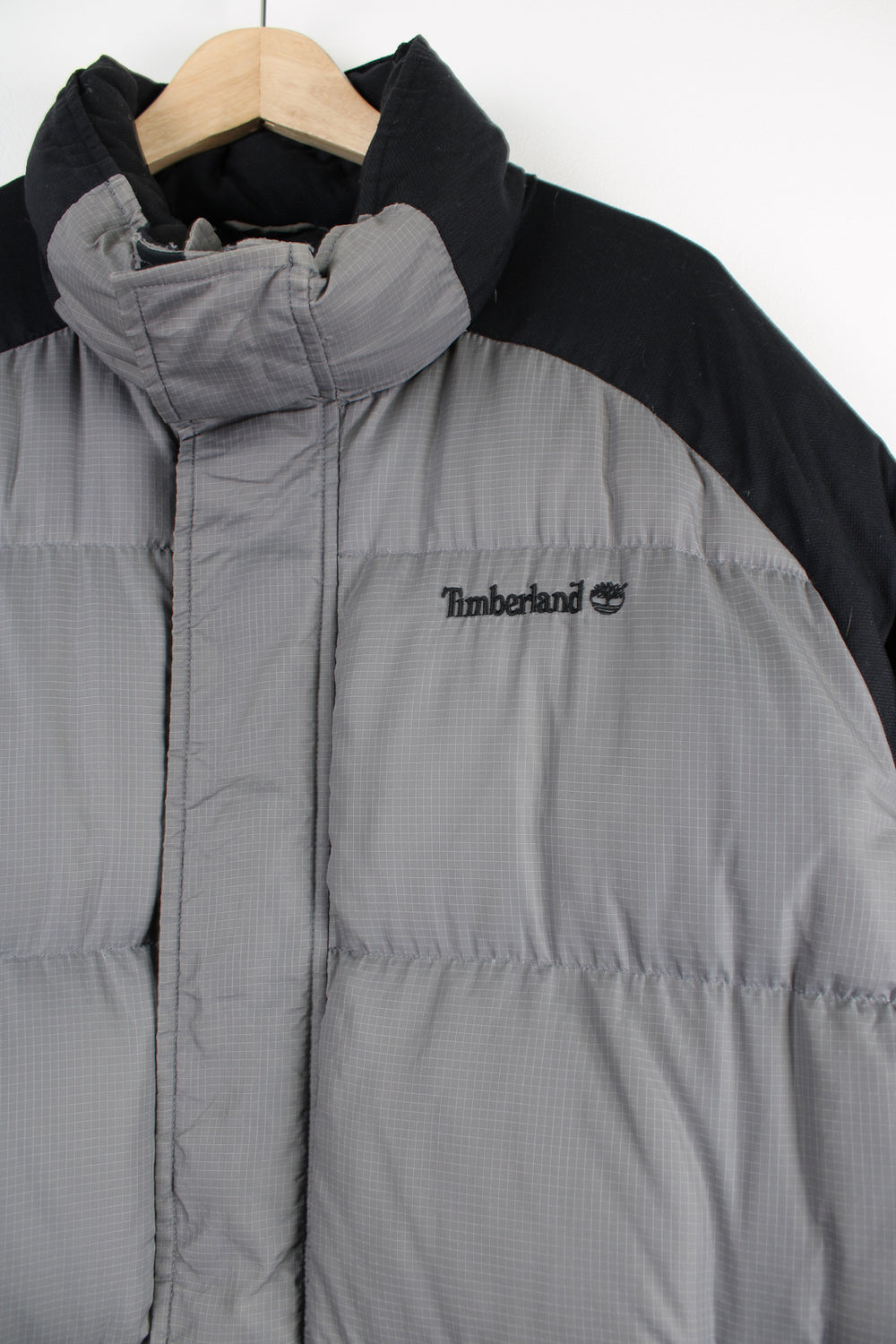 Timberland grey and black puffer jacket features embroidered logo on the chest 