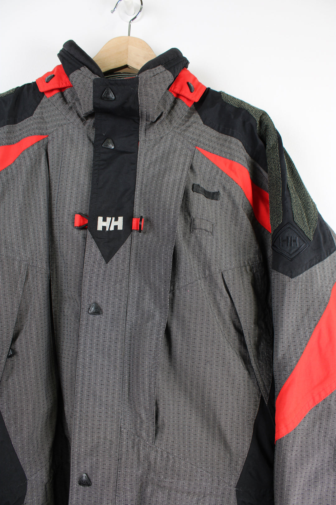 Vintage red and grey Helly Hansen, Helly Tech waterproof jacket, features multiple pockets and embroidered spell-out details on the chest and arm