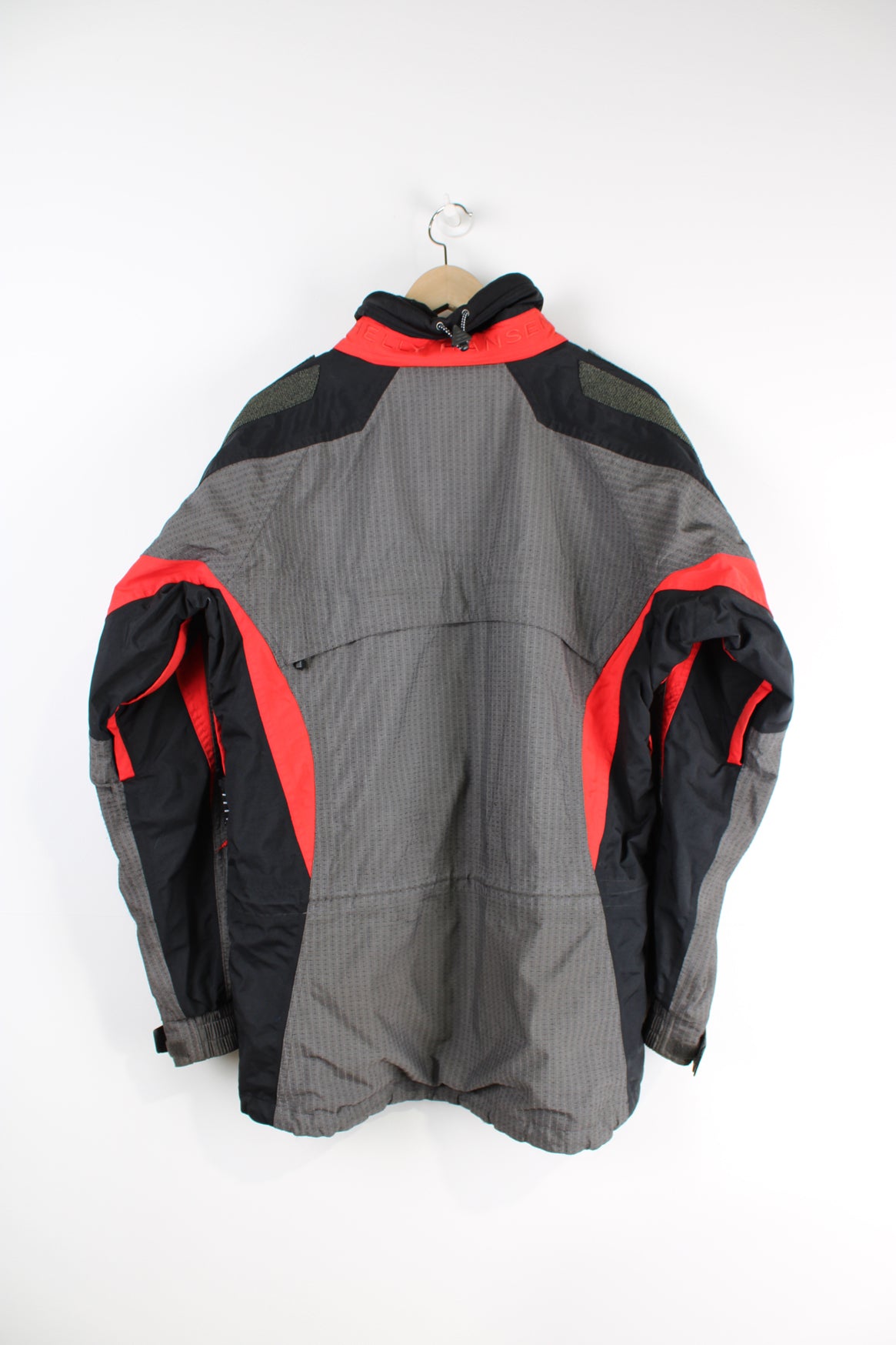 Vintage red and grey Helly Hansen, Helly Tech waterproof jacket, features multiple pockets and embroidered spell-out details on the chest and arm