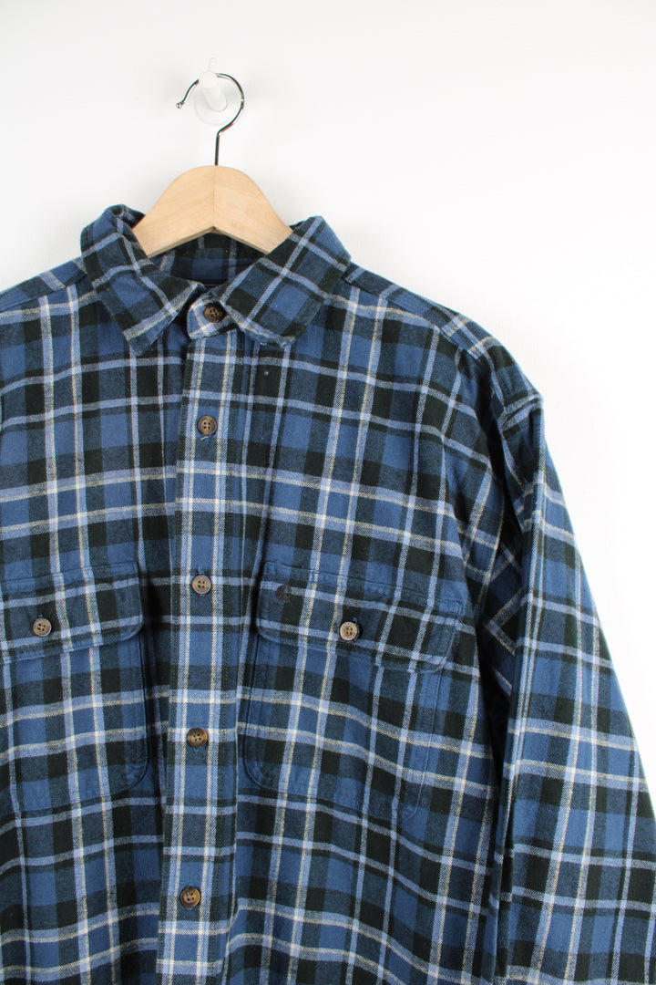 Carhartt blue check flannel button up shirt with long sleeves and branded logo on the chest pocket.  good condition  Size in Label:  Mens L 