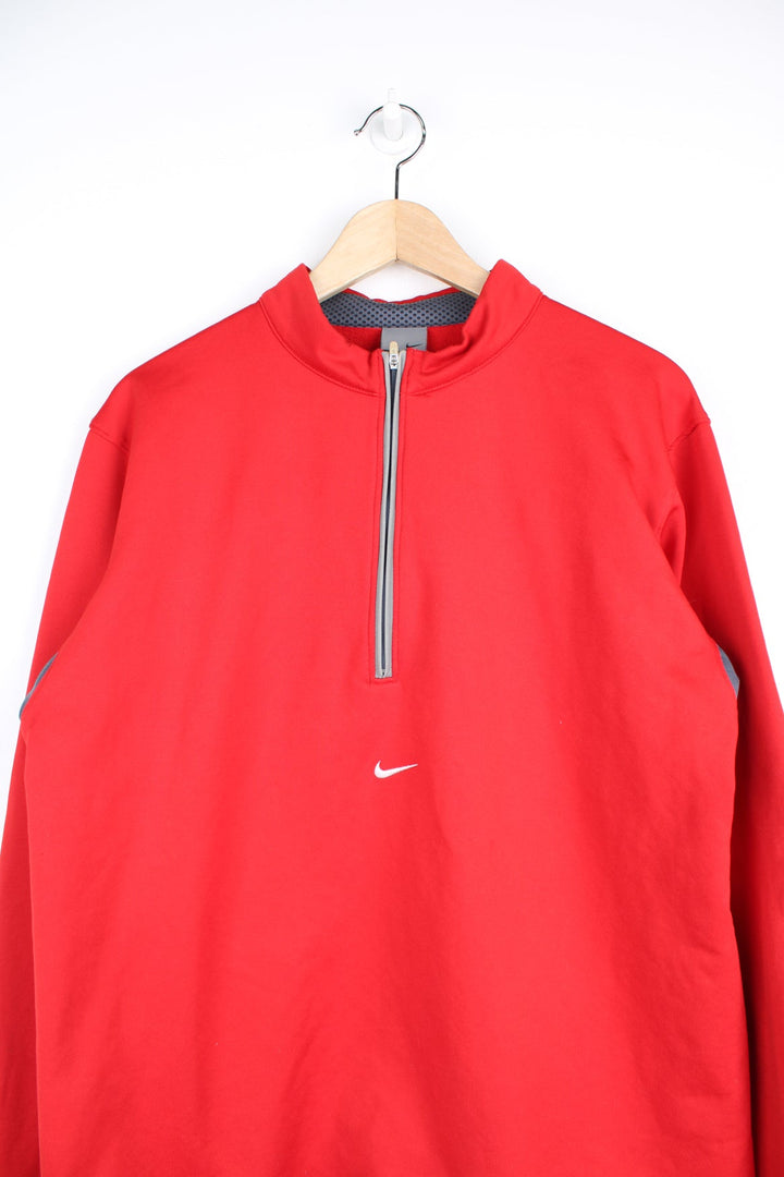 2000's Nike 1/4 zip nylon sweatshirt/fleece in red with embroidered swoosh logo on the chest