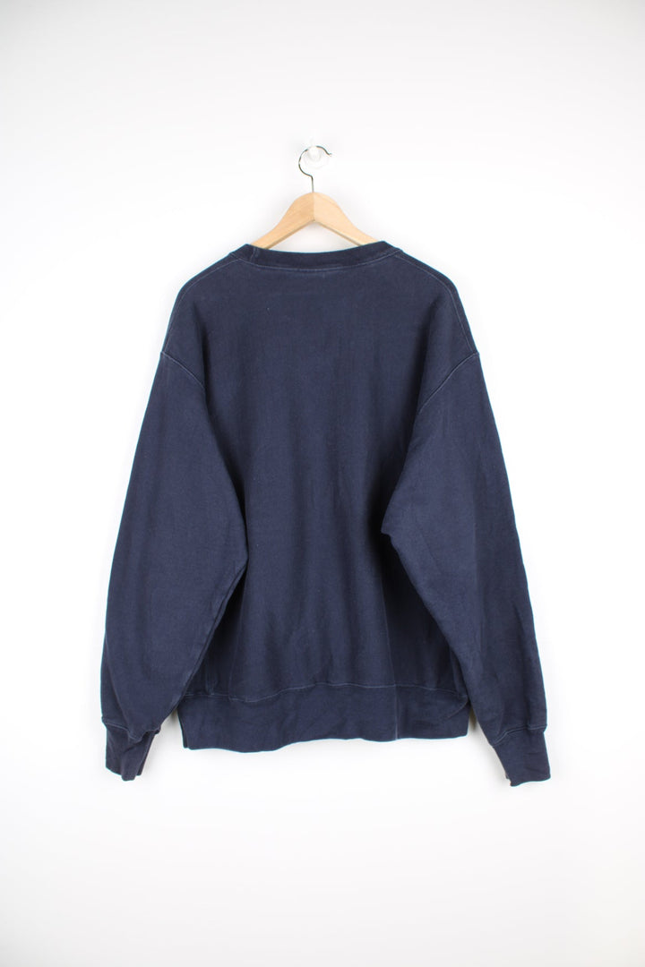 Vintage Champion reverse weave navy blue crewneck sweatshirt with embroidered spell-out logo across the chest