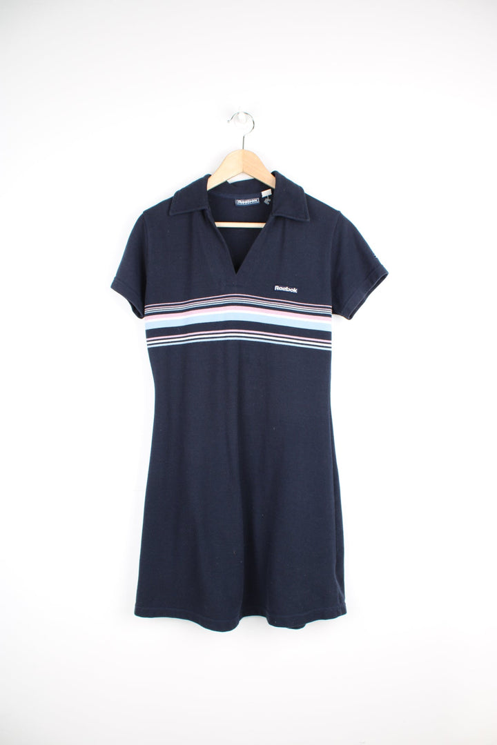 Y2K Reebok navy blue tennis dress with horizontal striped detail across the chest and embroidered logo.