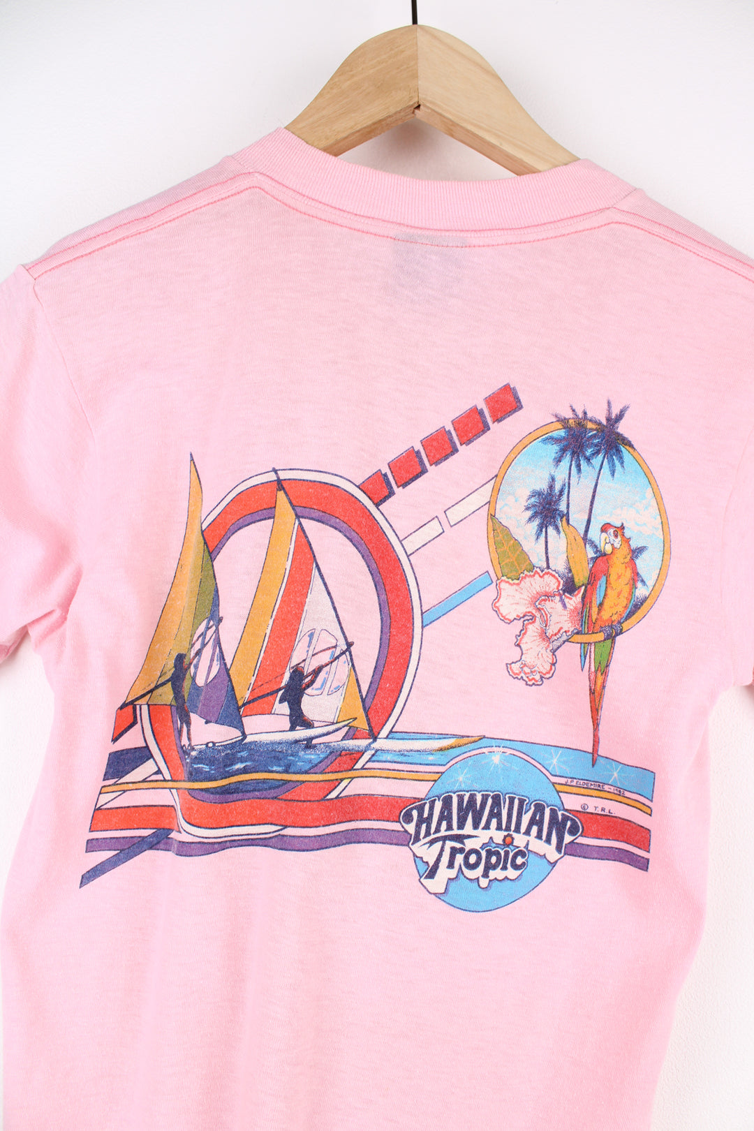 Vintage 1982 Hawaiian Tropic, Florida pink slim fit single stitch t-shirt with printed graphic on the front and back 