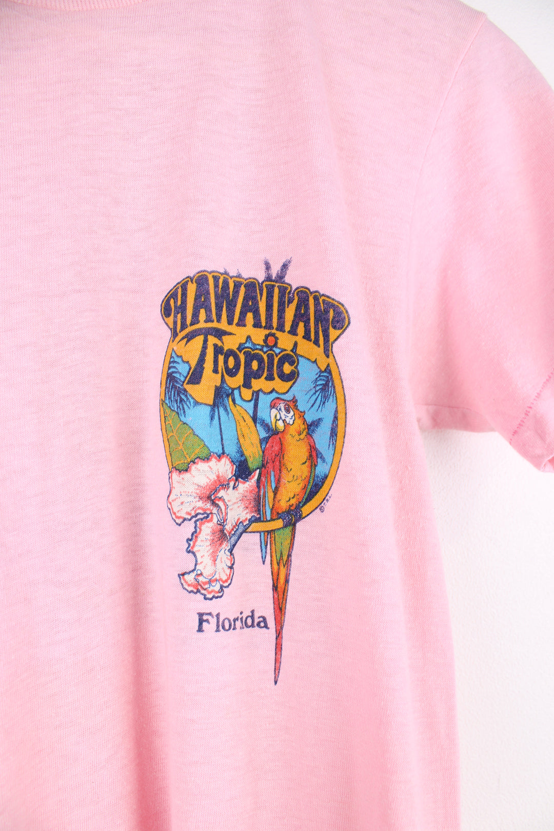 Vintage 1982 Hawaiian Tropic, Florida pink slim fit single stitch t-shirt with printed graphic on the front and back 