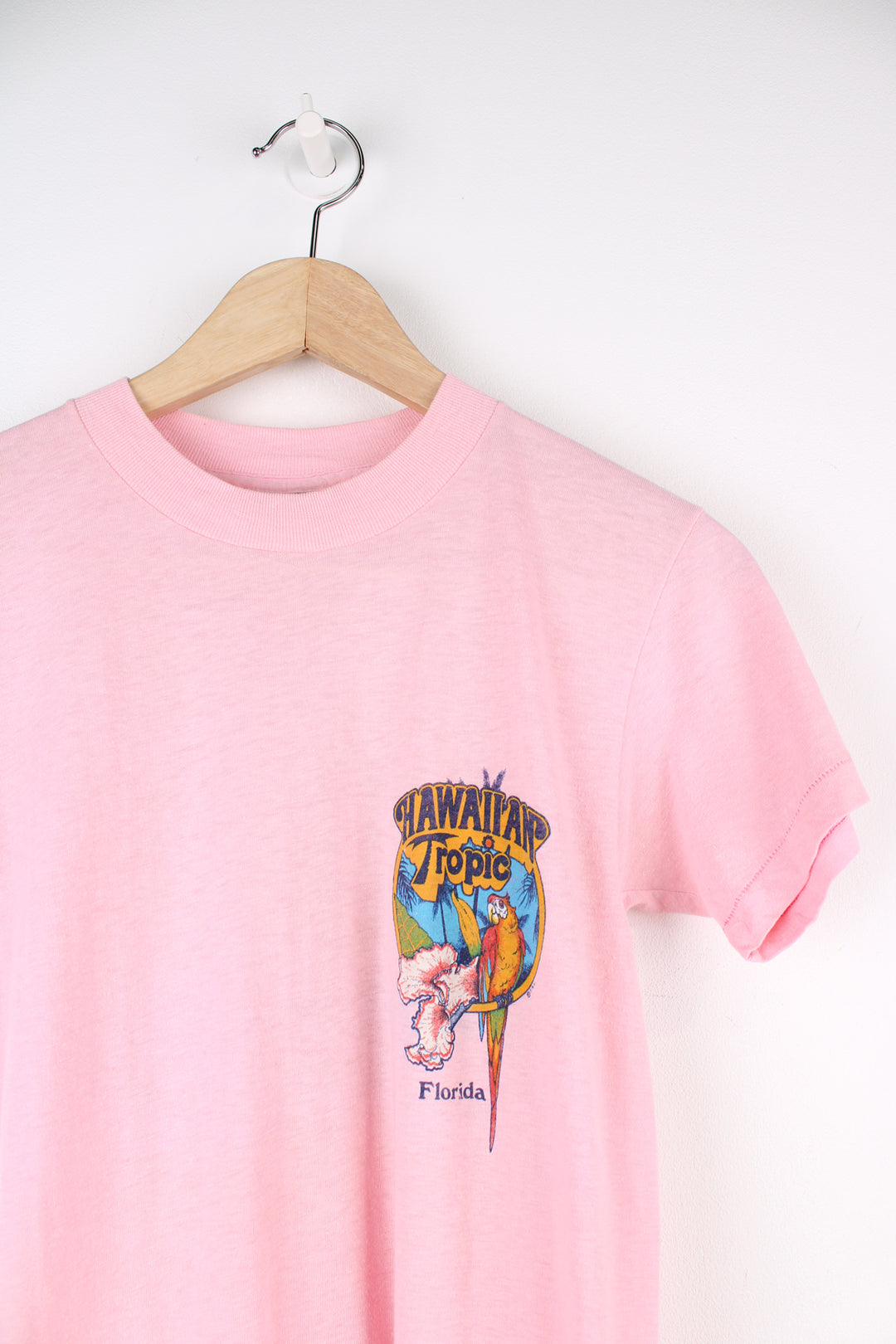 Vintage 1982 Hawaiian Tropic, Florida pink slim fit single stitch t-shirt with printed graphic on the front and back 