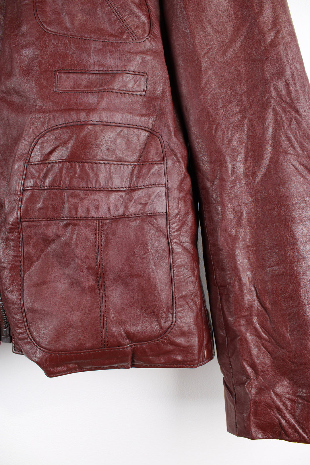 Vintage 1970's maroon leather jacket with zip to close. 