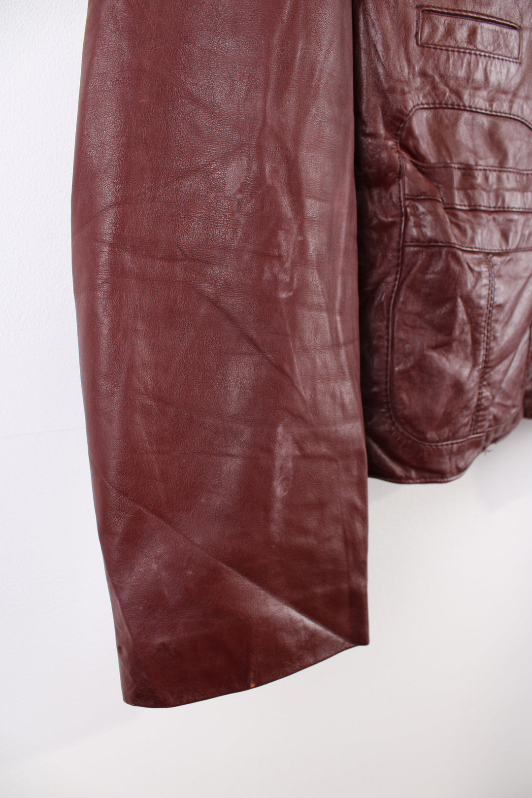 Vintage 1970's maroon leather jacket with zip to close. 