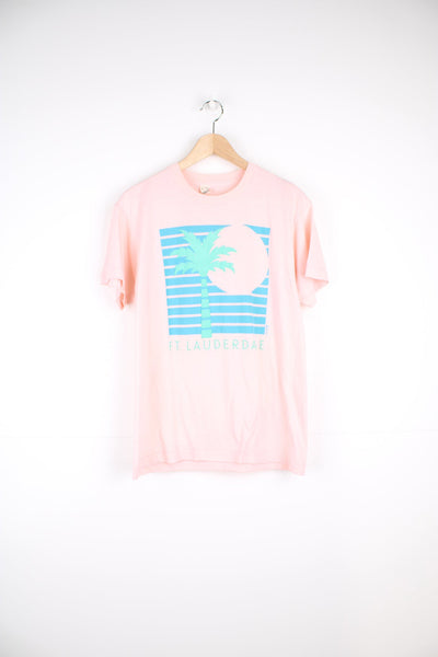 Vintage single stitch T-Shirt in pink with graphic palm tree print on the front.