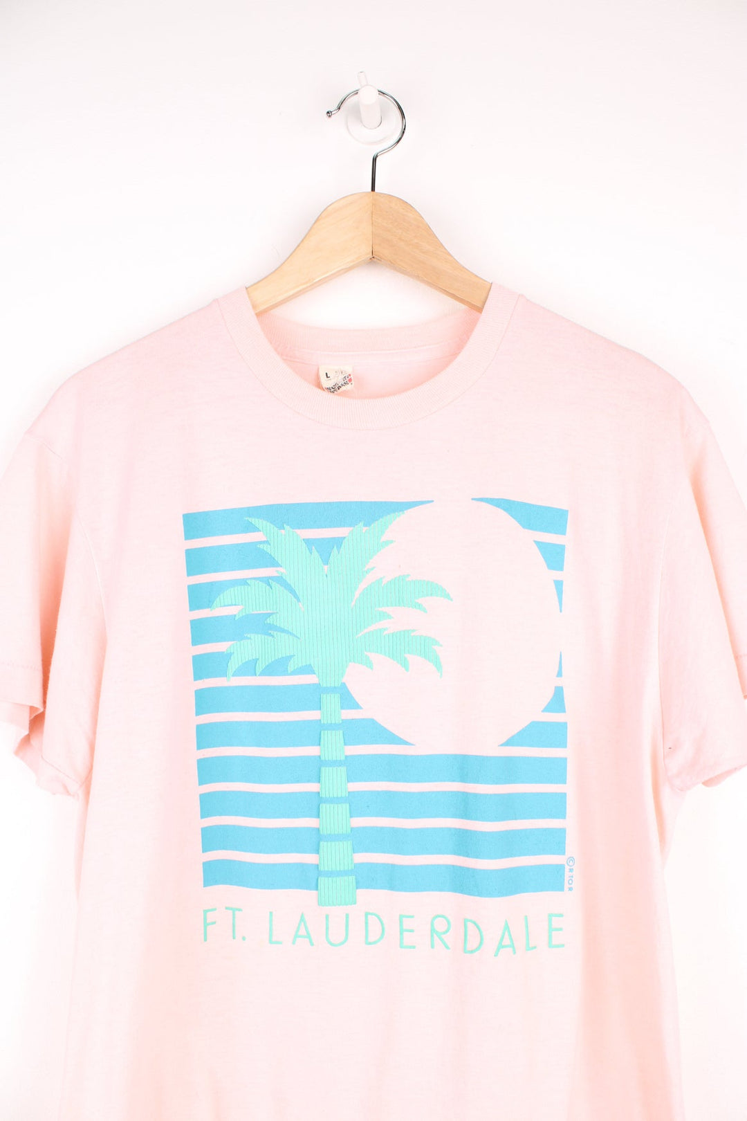 Vintage single stitch T-Shirt in pink with graphic palm tree print on the front.