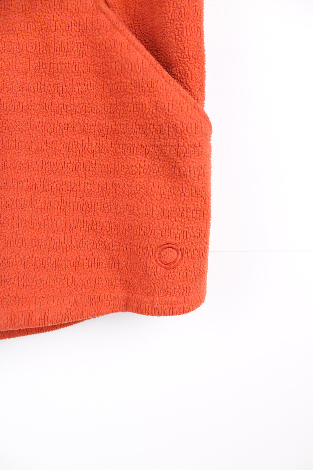 Nike Sphere Fleece Gilet in a orange colourway, zip up with side pockets, and has the logo embroidered on the front.