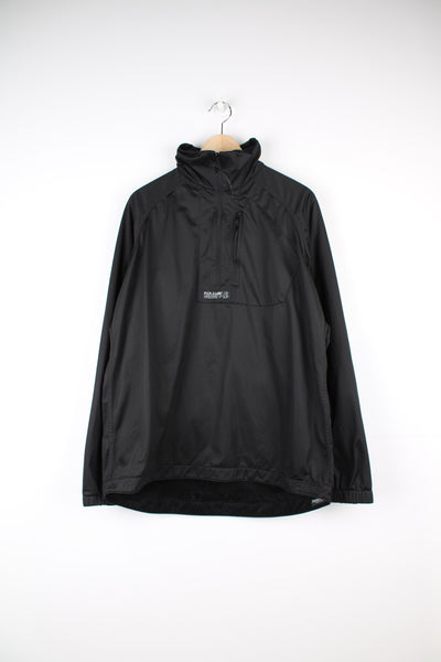 Paramo Parameta S Reversible Fleece in a black colourway, fleece or soft shell reversible options, half zip up, chest pocket, zips on the sleeves are air vents not pockets, and has the logo embroidered on.