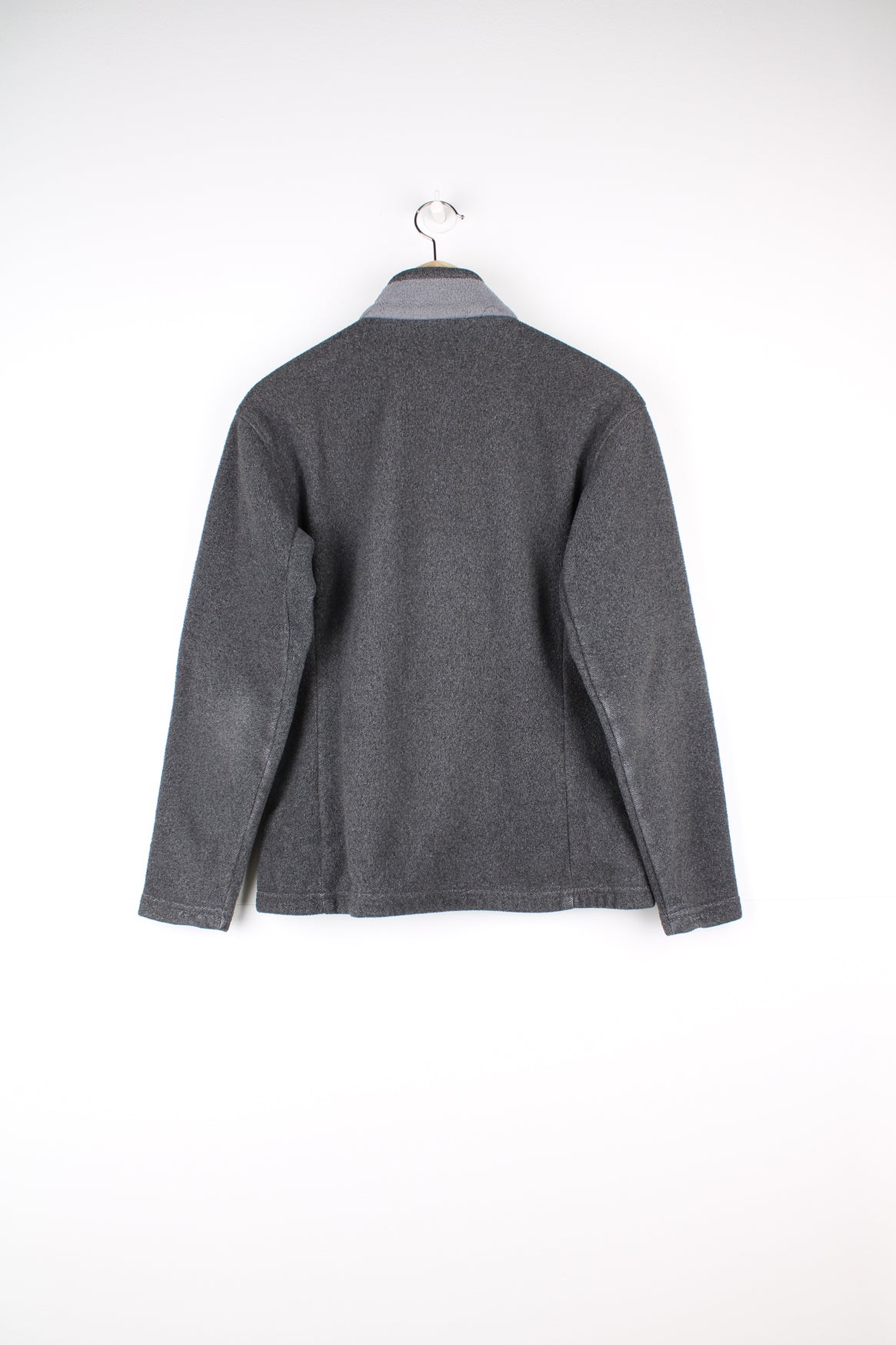 Patagonia Synchilla Fleece in a grey colourway, zip up with side pockets.