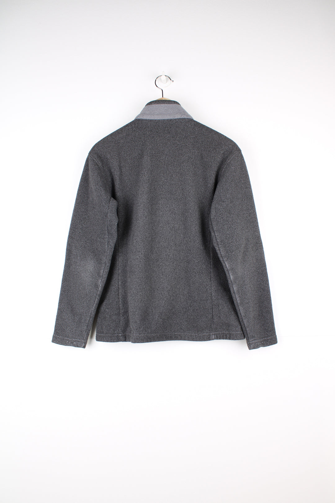 Patagonia Synchilla Fleece in a grey colourway, zip up with side pockets.