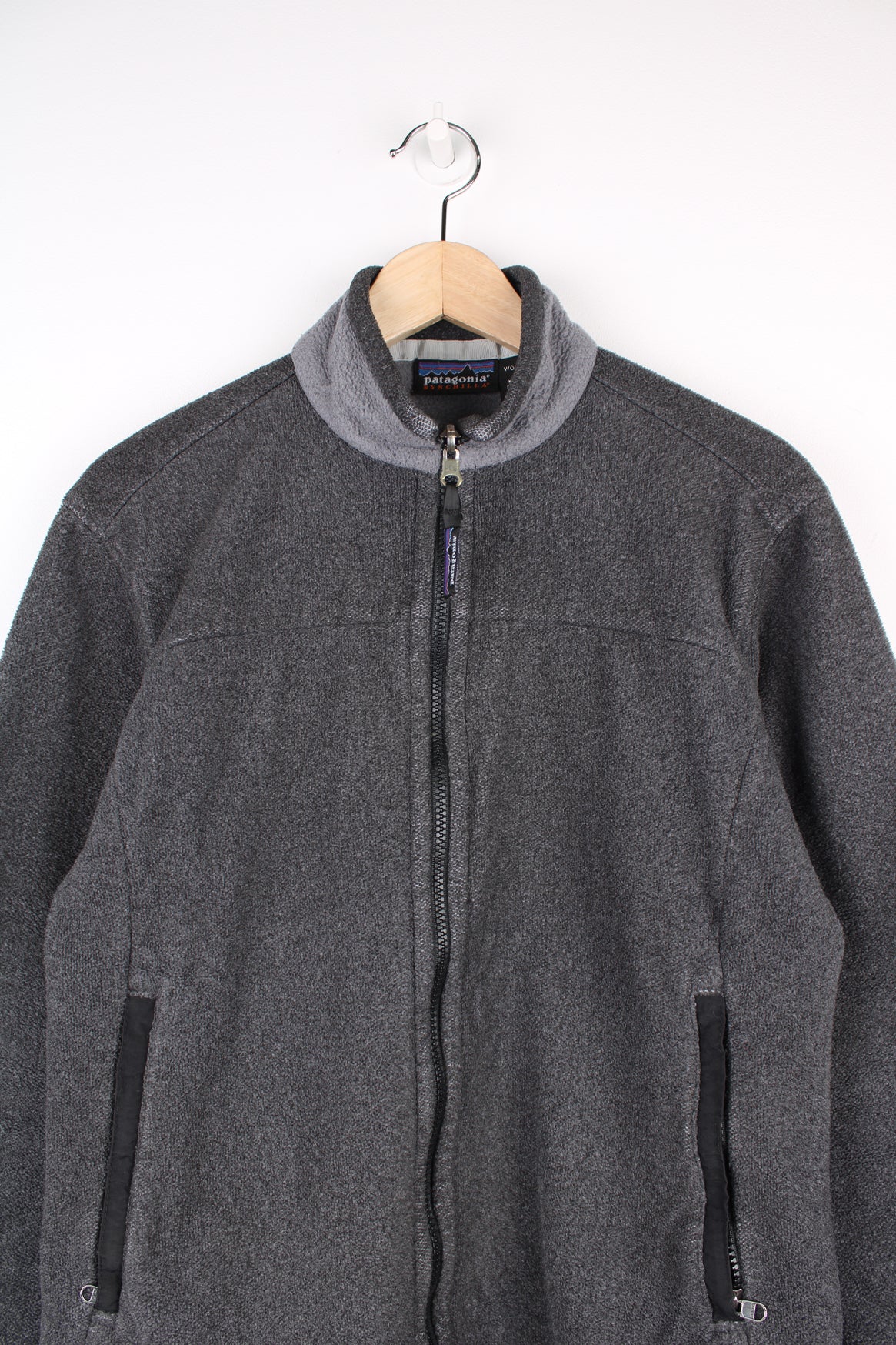 Patagonia Synchilla Fleece in a grey colourway, zip up with side pockets.