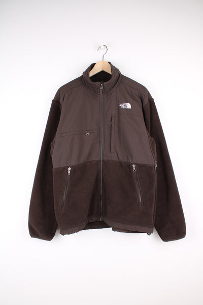 The North Face Denali Fleece in a brown colourway, zip up with multiple pockets, air vents under the arm pits, and has the logo embroidered on the front and back.