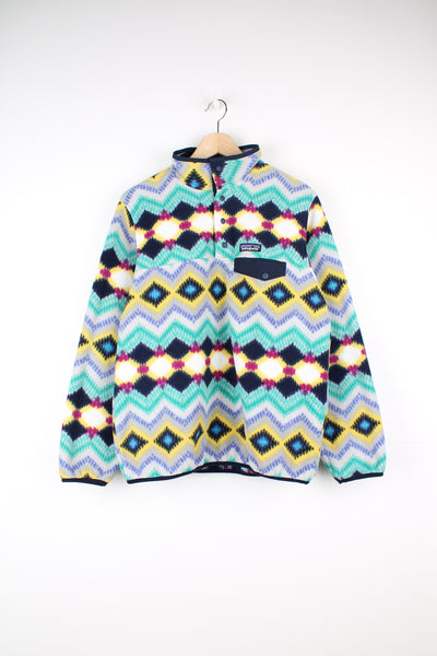 Patagonia Synchilla Snap-T Fleece, multicoloured and patterned, button up with a chest pocket, and has the logo embroidered on the front.
