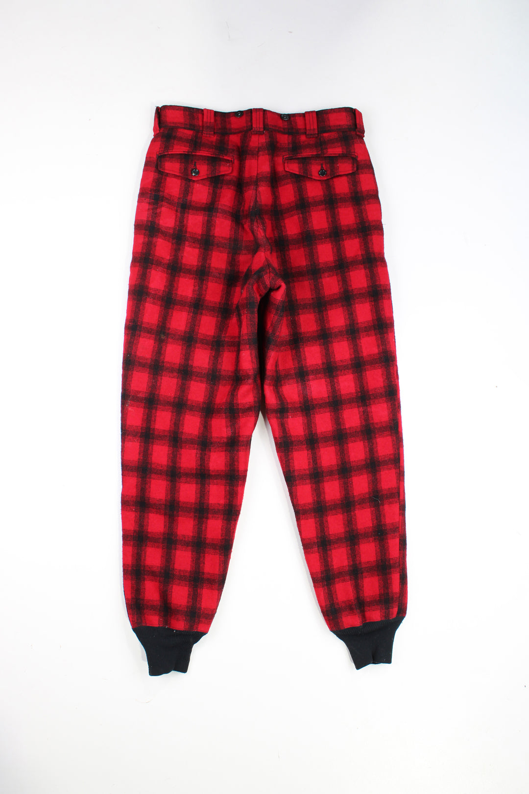  Vintage 60's Woolrich hunting trousers. Red check wool trousers with elasticated cuffs and quilted lining.   good condition - one small mark on the leg (see photos)  Size in Label:  Mens 32 (M)  Our Measurements:  Waist: 33 inches  Leg Inseam: 32 inches