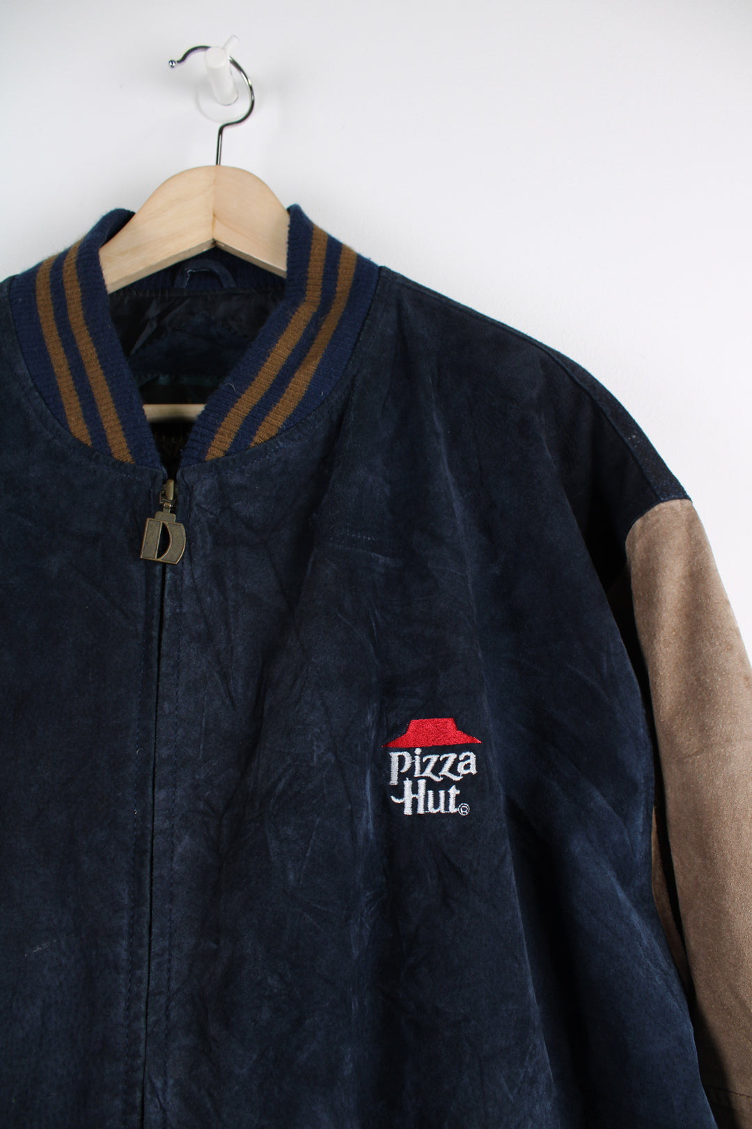 Vintage Pizza Hut Leather Varsity Jacket in a blue and brown colourway, nylon lining, zip up, and has embroidered logo on the chest.