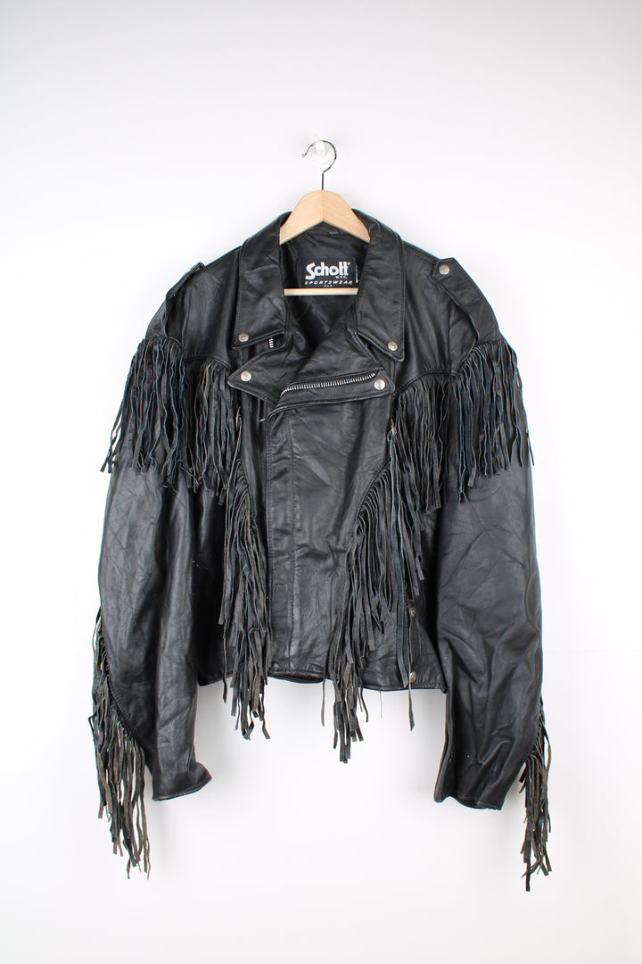 Vintage black leather zip through biker jacket with fringe by Schott features chunky hardware and silvery western style conch buttons 