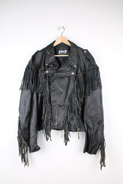 Vintage black leather zip through biker jacket with fringe by Schott features chunky hardware and silvery western style conch buttons 