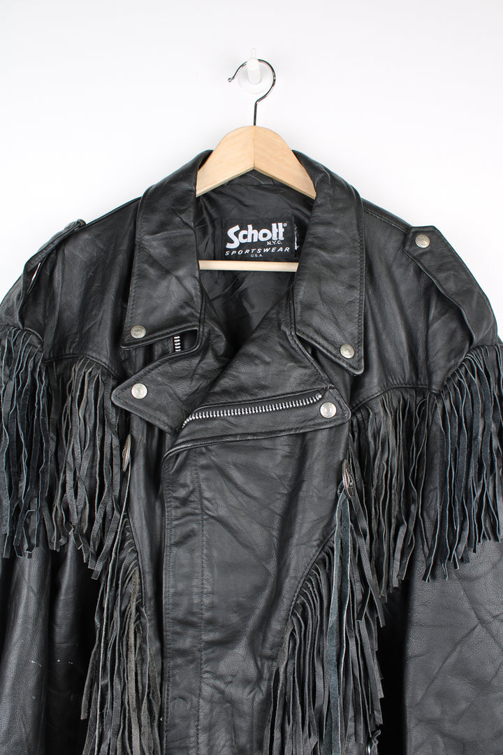 Vintage black leather zip through biker jacket with fringe by Schott features chunky hardware and silvery western style conch buttons 