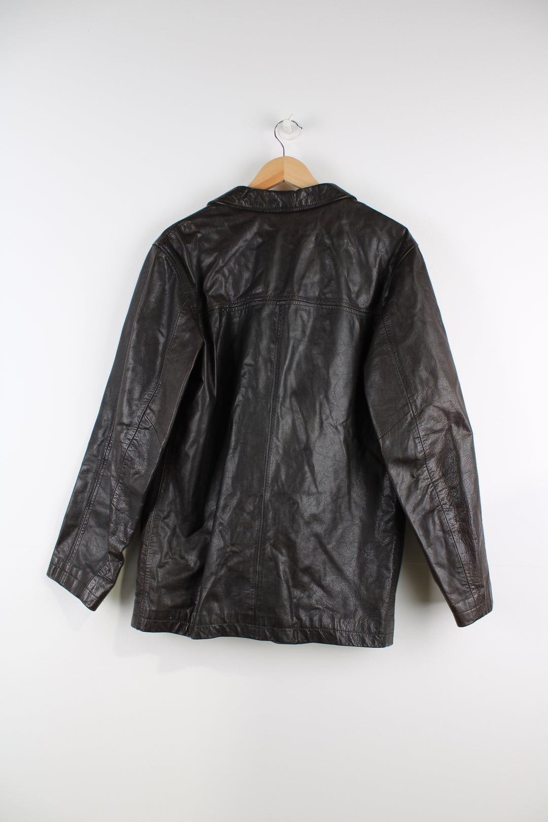 Vintage Emporio Armani Leather Jacket in a brown colourway, button up with a big collar, and has multiple pockets.