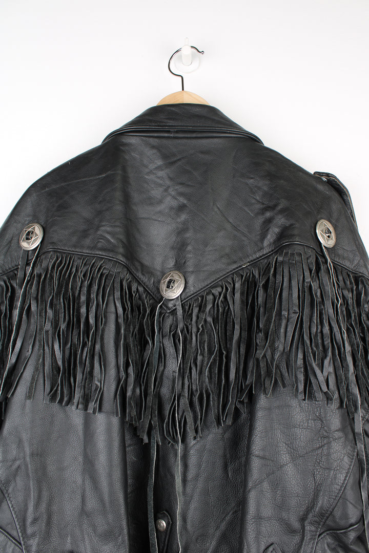 Vintage black leather zip through biker jacket with fringe by Schott features chunky hardware and silvery western style conch buttons 