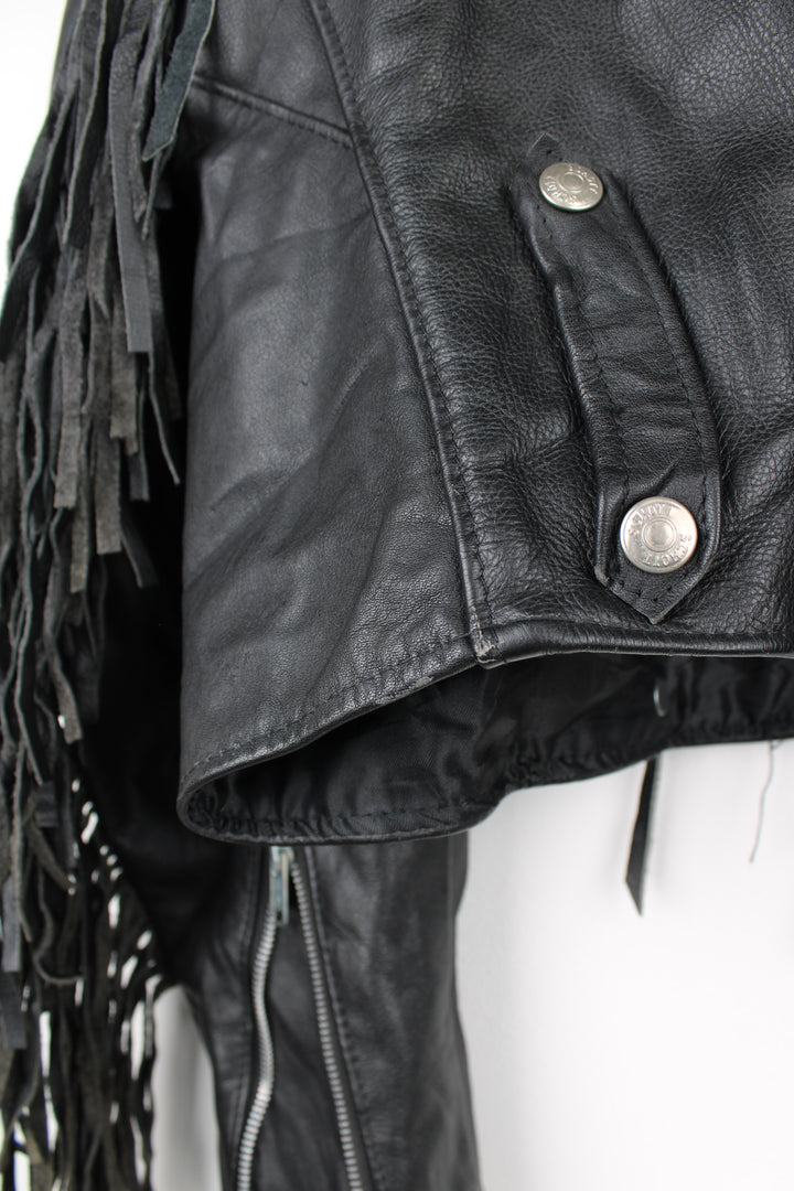 Vintage black leather zip through biker jacket with fringe by Schott features chunky hardware and silvery western style conch buttons 