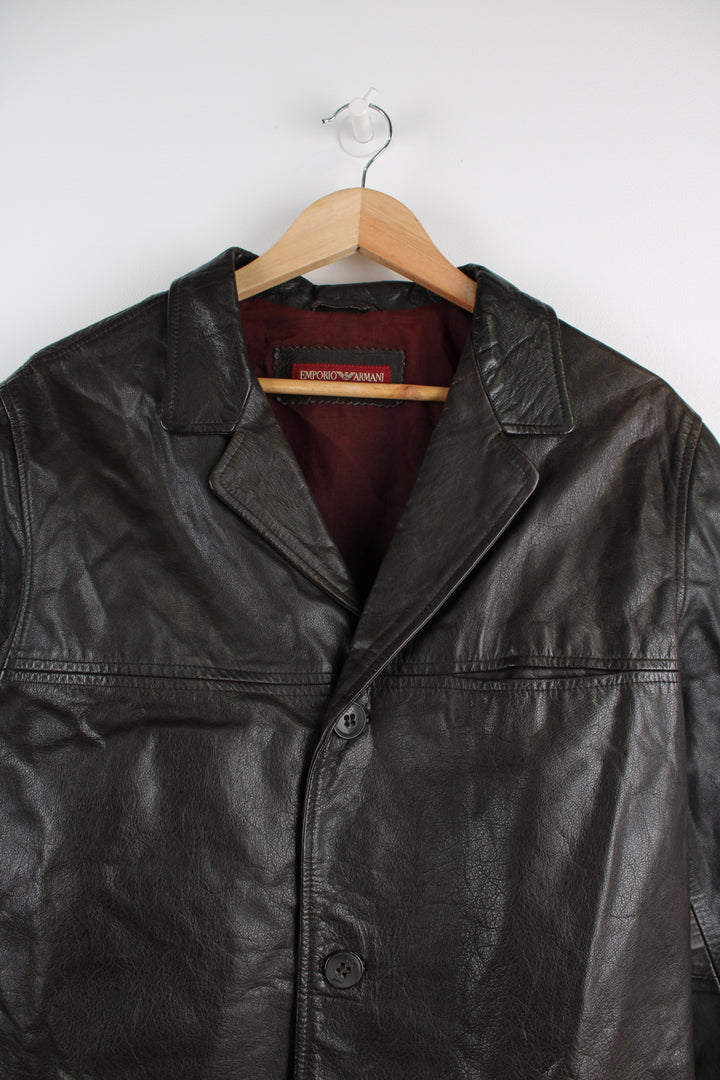 Vintage Emporio Armani Leather Jacket in a brown colourway, button up with a big collar, and has multiple pockets.