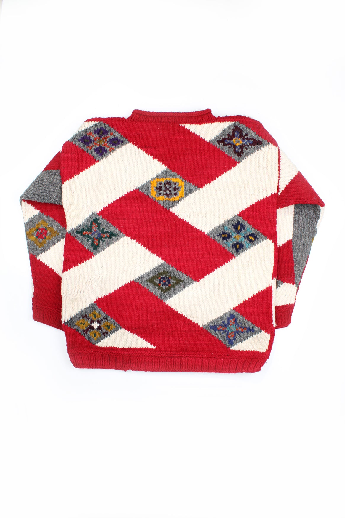 Vintage chunky  knit jumper with red, cream and grey geometric motif on the front. 100% wool and handmade in Ecuador.  good condition  Size in Label:  No Size - Measures like a size L/ XL 