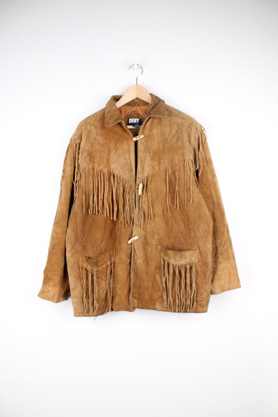 Vintage 90's DKNY fringe jacket. Tan suede jacket with fringe and whip stitch detail. The jacket is fully lined and closes with wooden toggle style buttons down the front. Fair condition - The jacket is discoloured in places and is missing some tassels on the shoulder and pocket. Size in Label: Womens L 12 - 14 