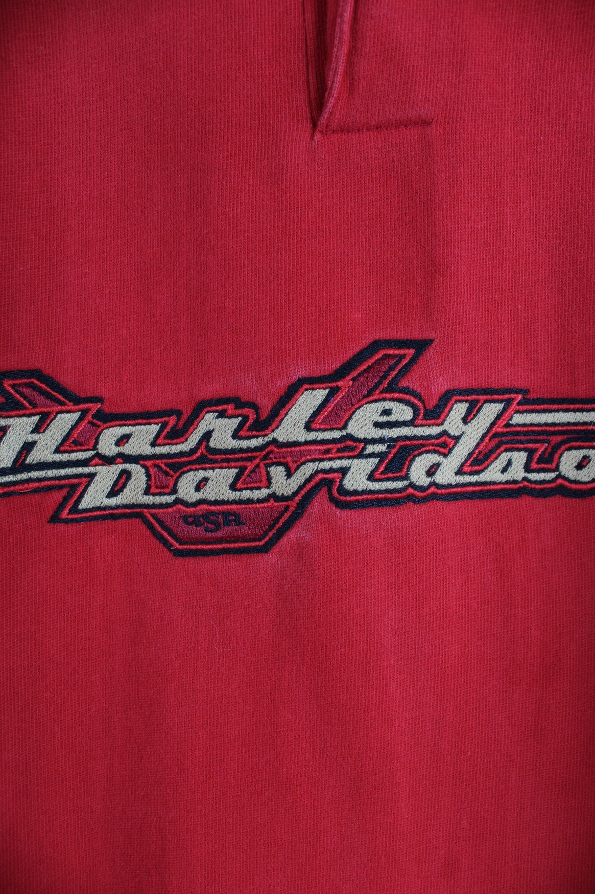 Harley Davidson Long Sleeve T-Shirt in a red colourway, quarter button up, and has the logo embroidered across the chest.