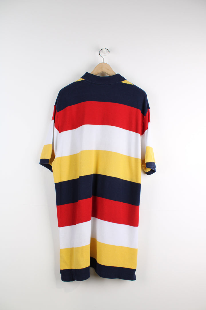 Ralph Lauren Polo Shirt in a blue, red, white and yellow striped colourway, 1/4 button up and has the logo embroidered on the chest.