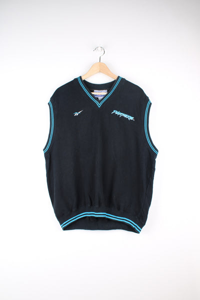 Reebok NFL Pro Line, Carolina Panthers Sweater Vest in a black and blue colourway, v neck, and has the logos embroidered on the front and back.