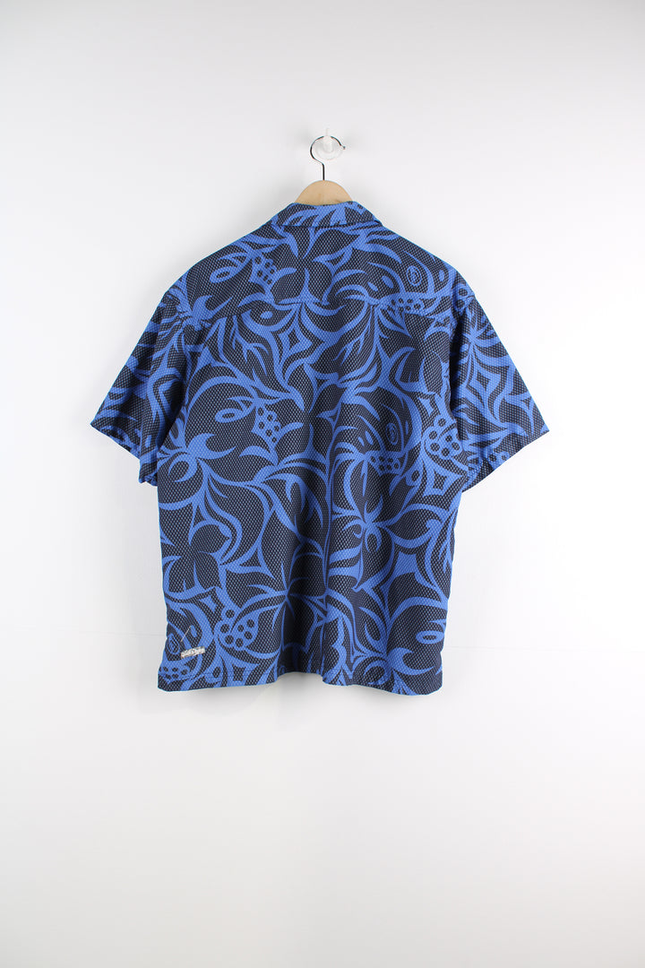 Quiksilver Short Sleeved Hawaiian Shirt in a blue and black colourway, button up with a chest pocket, and logo embroidered on the back.