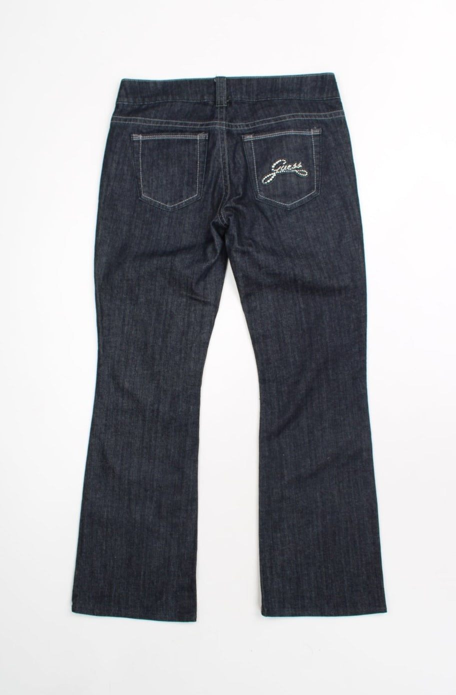 Dark blue Y2K Guess jeans. Low rise bootcut fit with rhinestone detail on the pockets. 