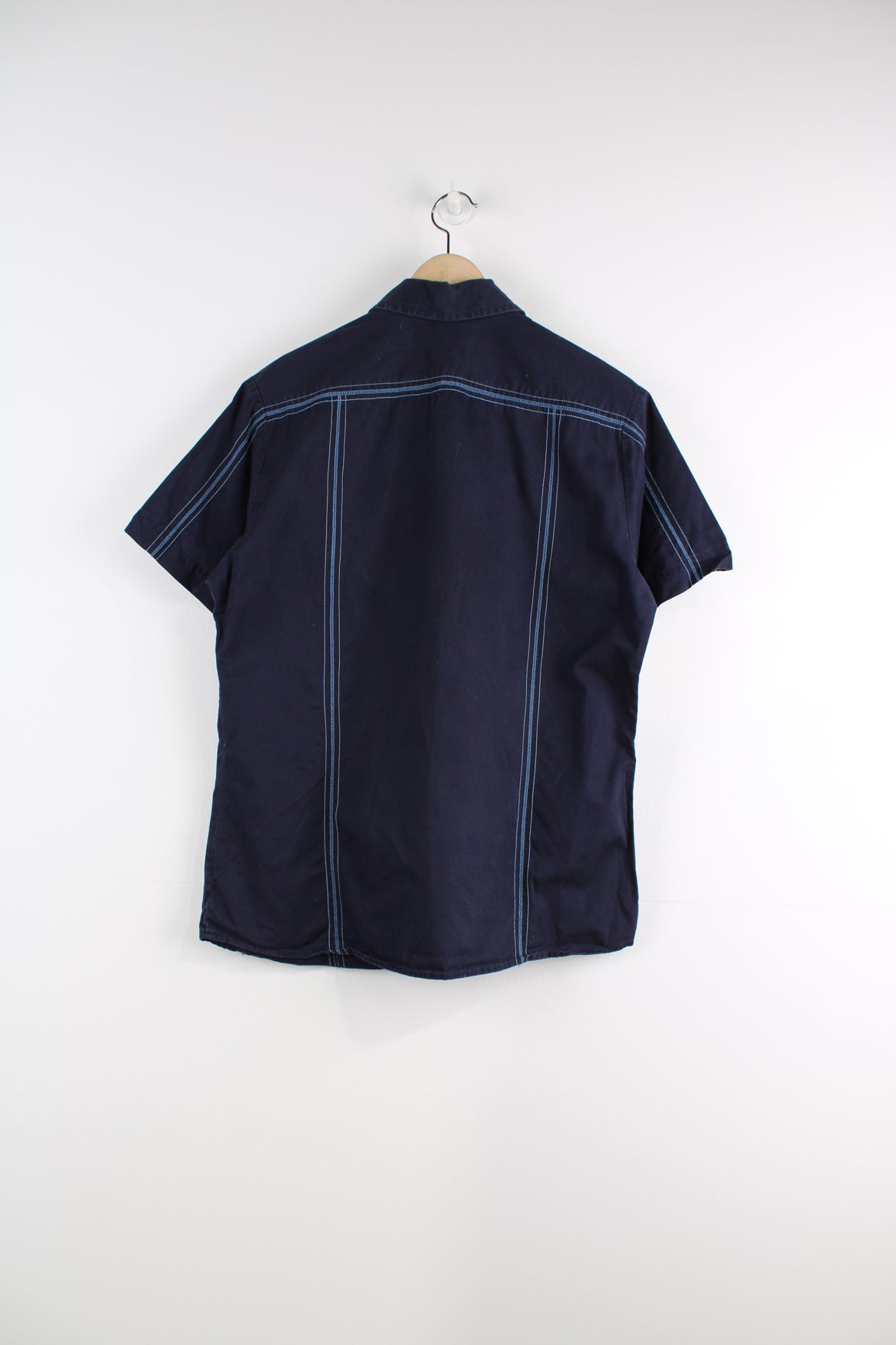 Diesel Short Sleeved Workwear Shirt in a blue colourway, striped cross stitching throughout, button up, and logo embroidered on the front.