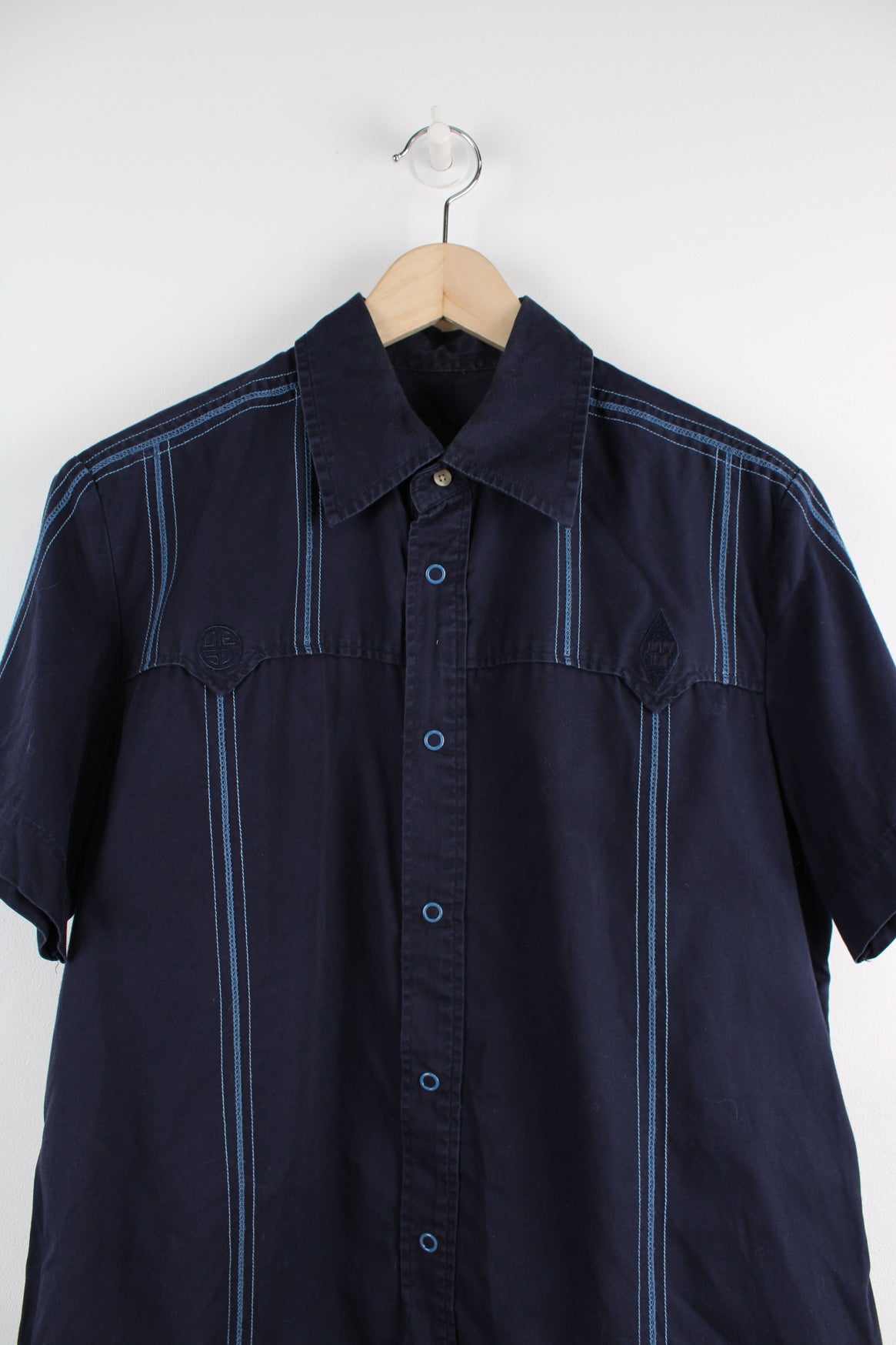 Diesel Short Sleeved Workwear Shirt in a blue colourway, striped cross stitching throughout, button up, and logo embroidered on the front.