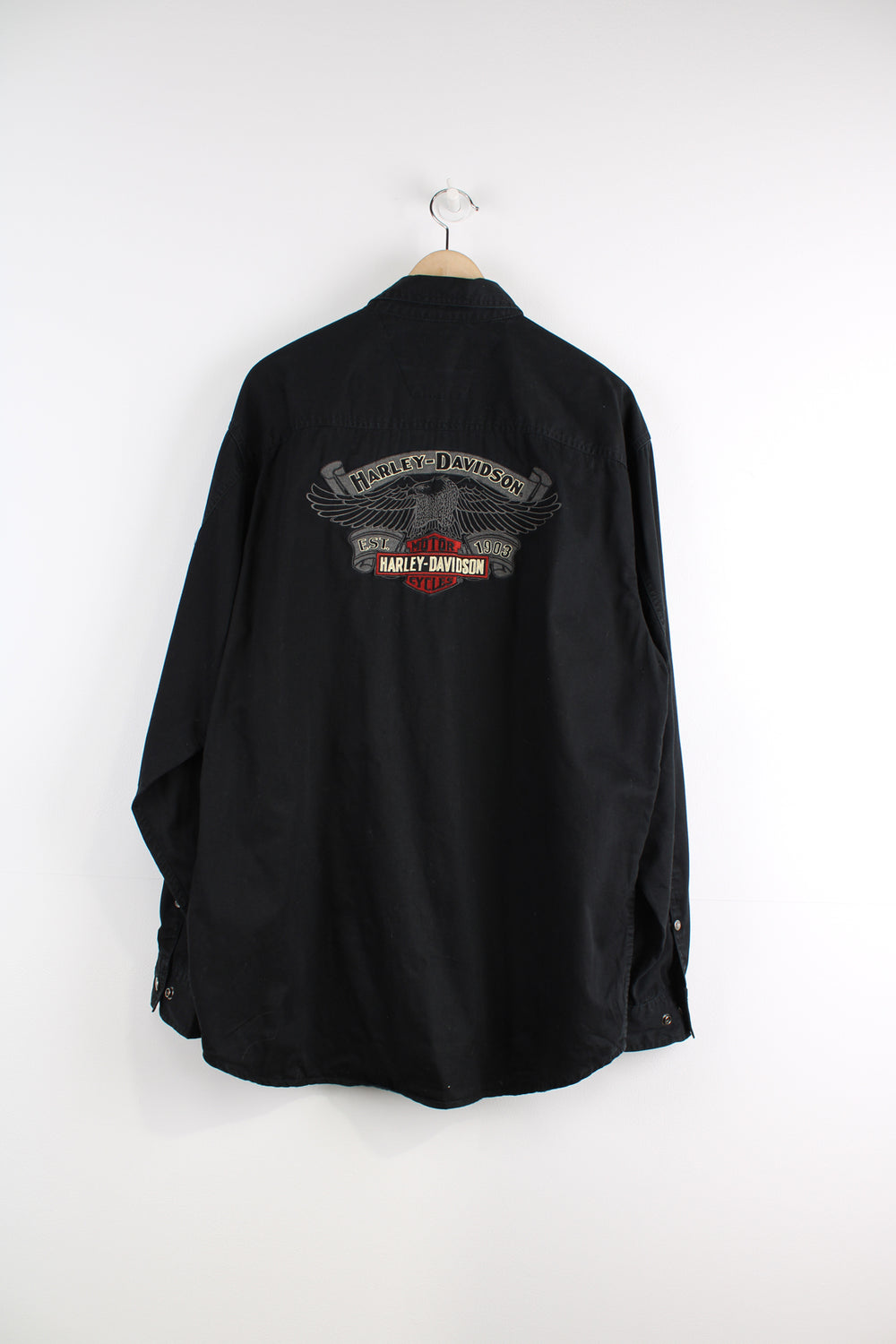 Harley Davidson Long Sleeved Shirt in a black colourway, button up, double chest pockets and logo embroidered on the front and big spell out on the back.