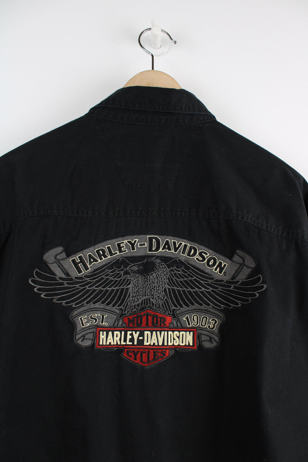 Harley Davidson Long Sleeved Shirt in a black colourway, button up, double chest pockets and logo embroidered on the front and big spell out on the back.