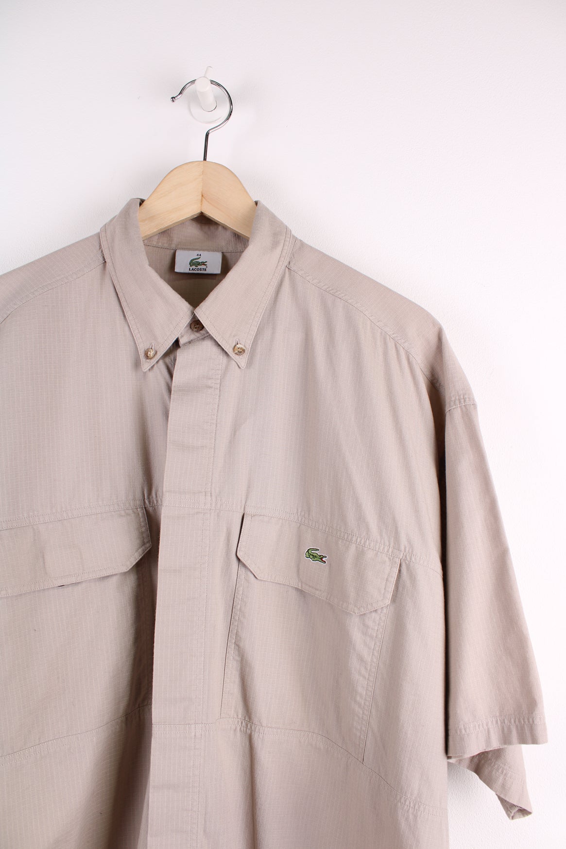 Lacoste Short Sleeve Shirt in a tan colourway, button up, double chest pockets, and logo embroidered on the side.