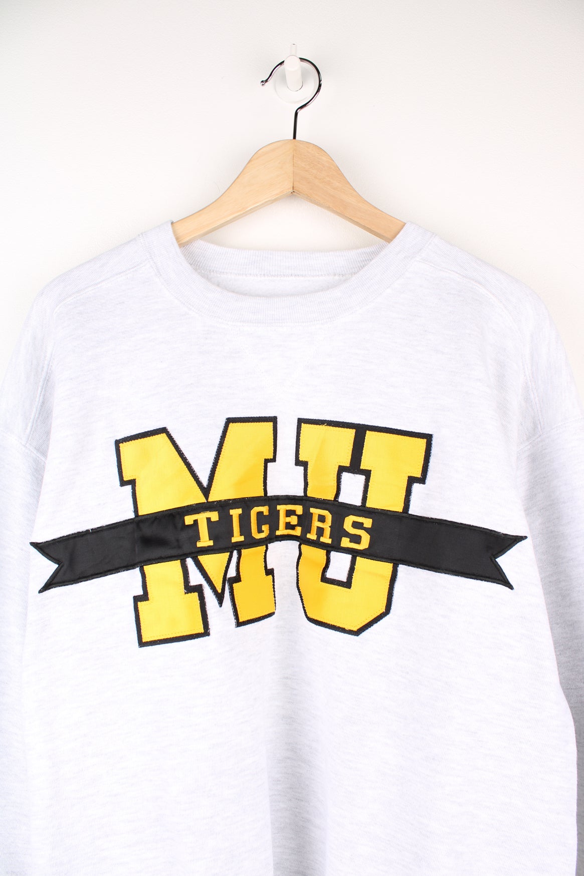 Missouri University Tigers Football Team Sweatshirt in a grey colourway, with big embroidered team initials on the front.