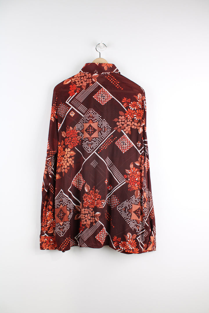 Vintage 70's Sears Patterned Shirt in a maroon colourway with floral pattern printed all over, button up, and has a dagger collar.