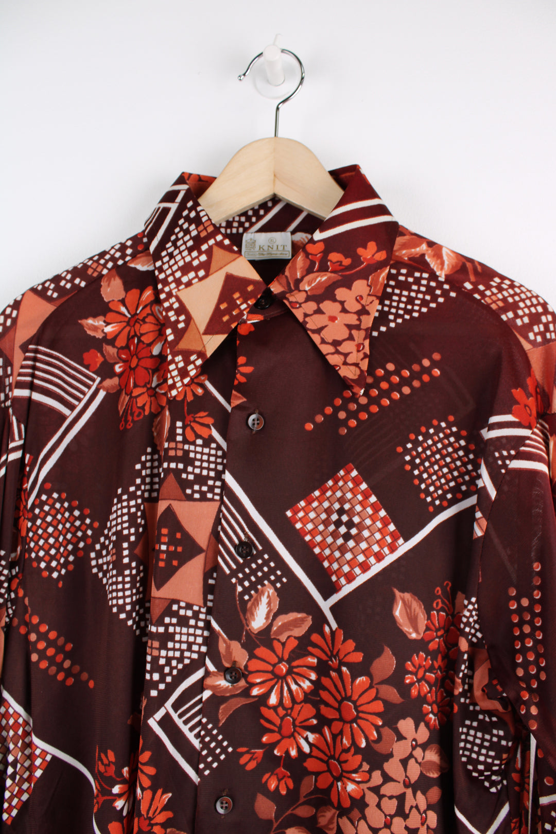 Vintage 70's Sears Patterned Shirt in a maroon colourway with floral pattern printed all over, button up, and has a dagger collar.