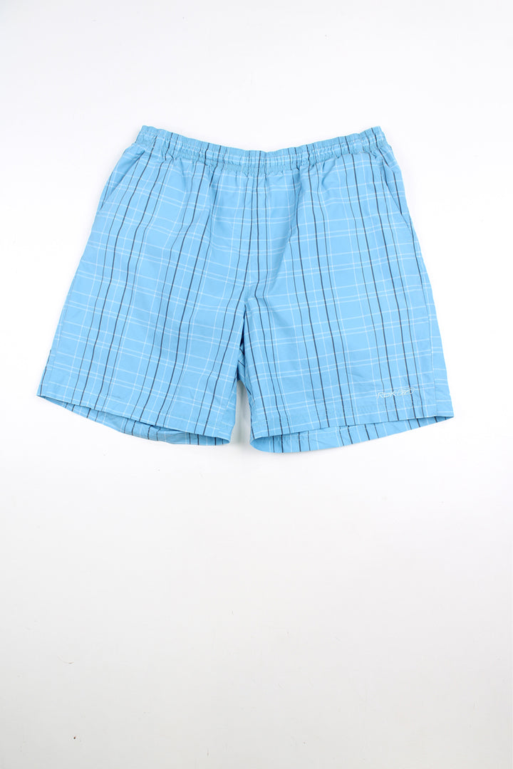 Blue Reebok checked shorts with elasticated waist and drawstring. Features embroidered logo on the leg