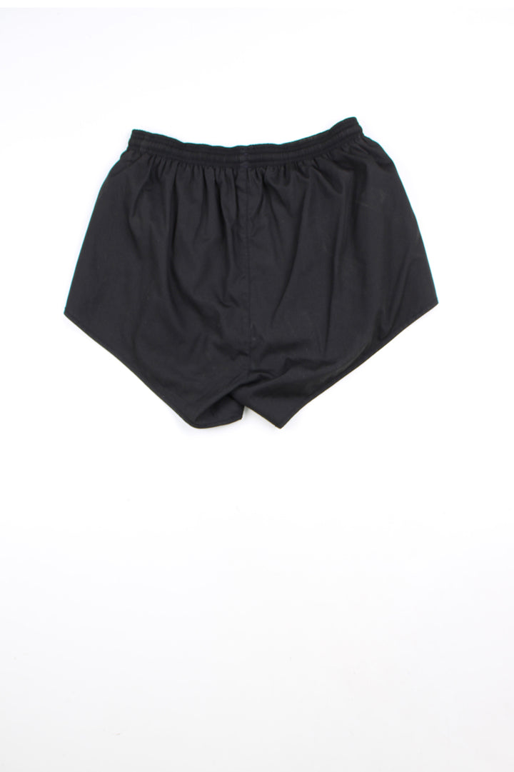 00's black Adidas running shorts with elasticated waist and drawstring tie. Features embroidered logo on the front leg.