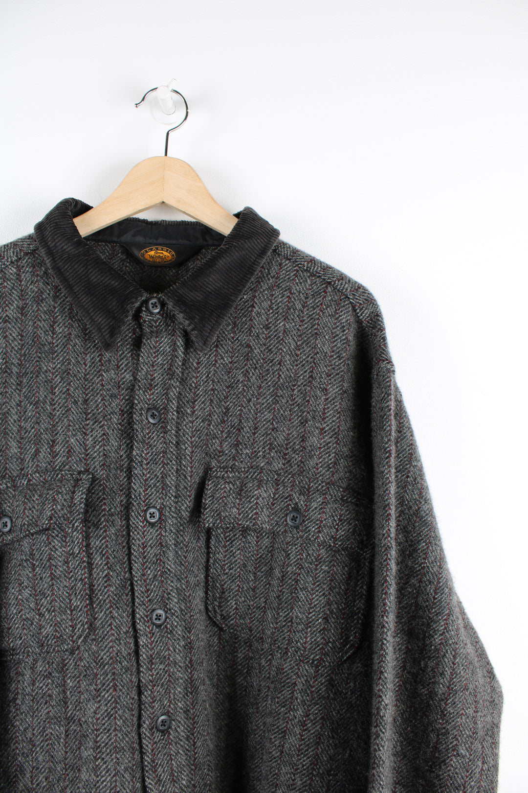 Vintage Woolrich Classics wool jacket in a grey, black and red striped colourway, has a dark brown corduroy collar, button up with double chest pockets.