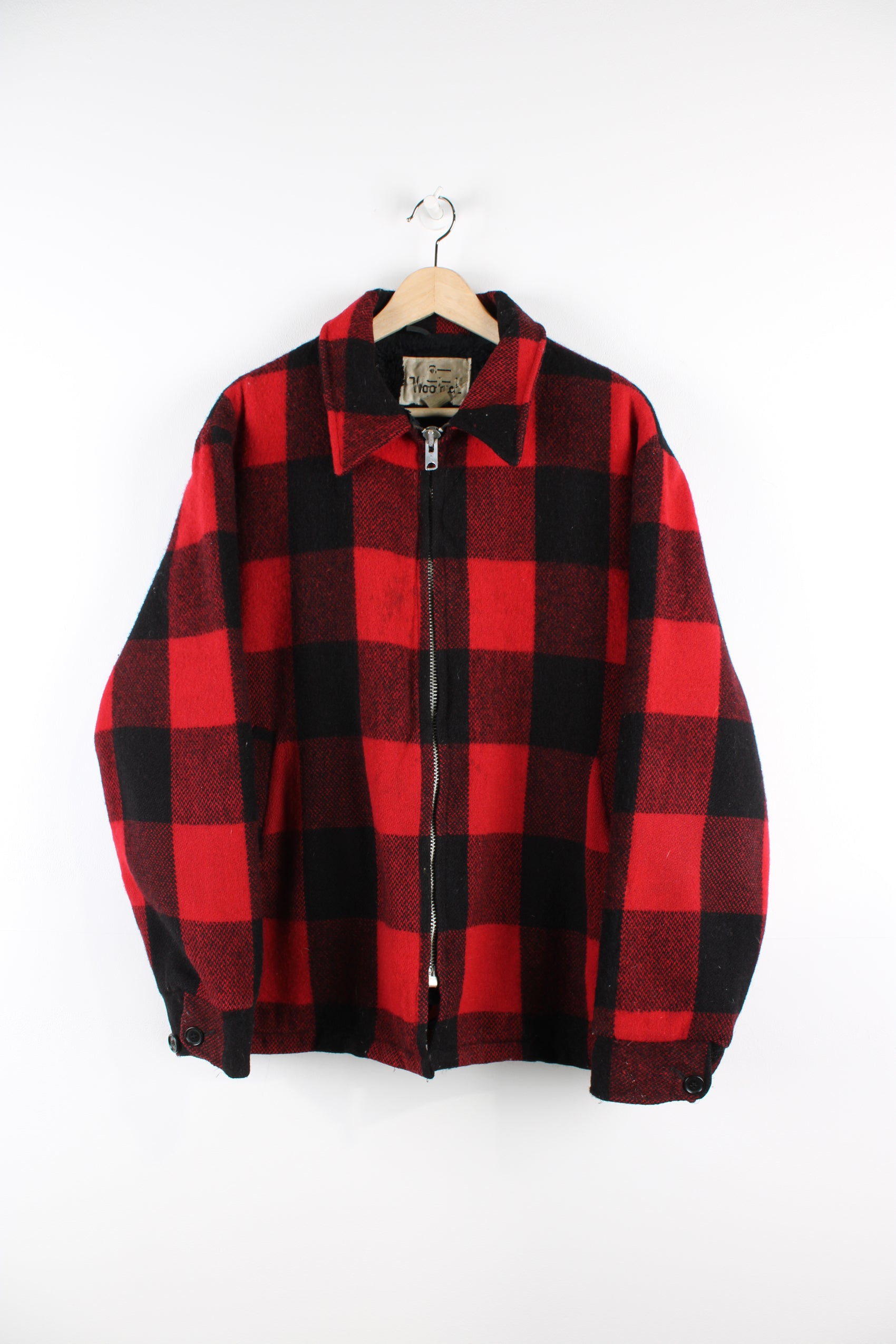 Vintage Woolrich red & black plaid wool CPO jacket, zip up with side pockets and fleece lining.