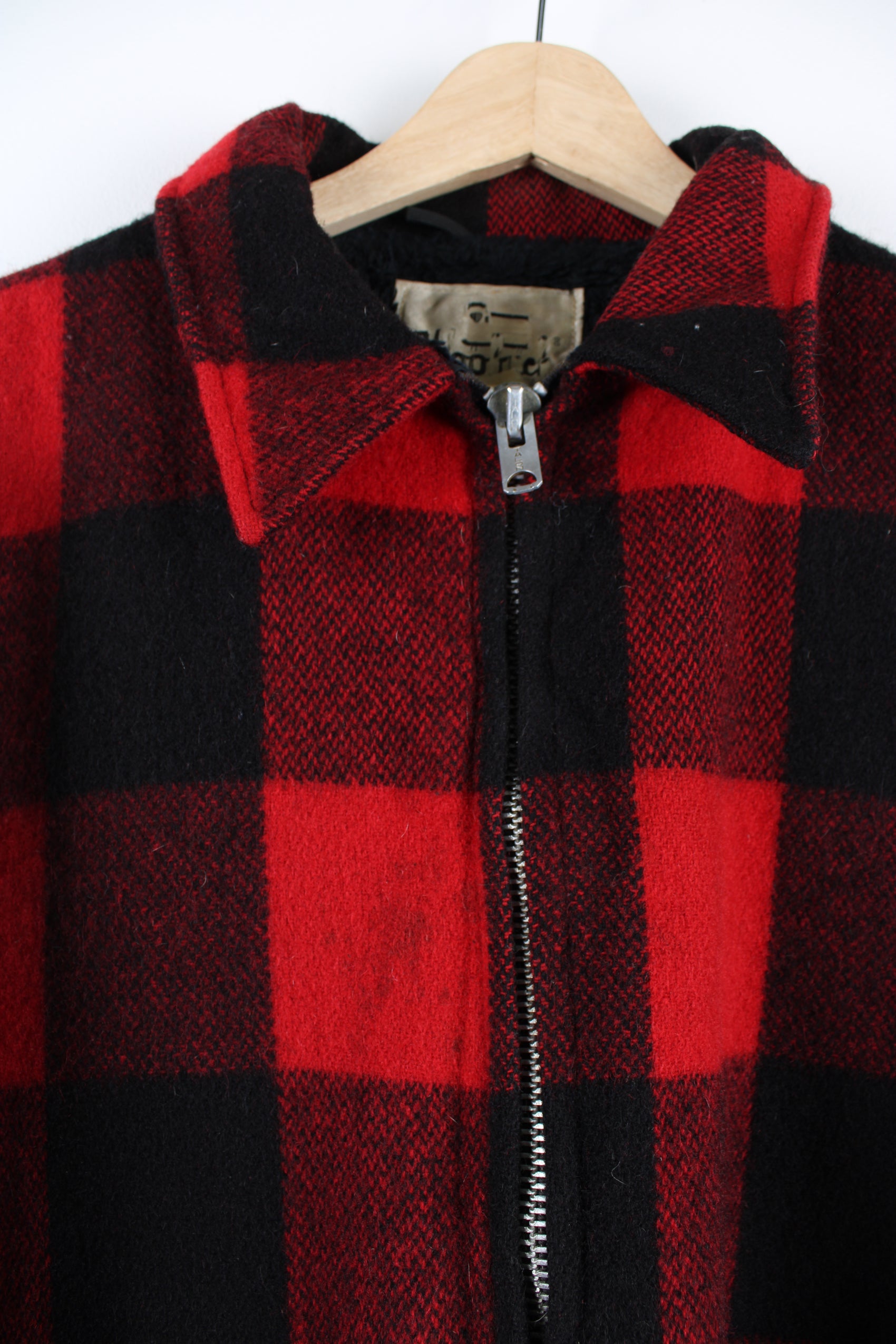 Vintage Woolrich red & black plaid wool CPO jacket, zip up with side pockets and fleece lining.